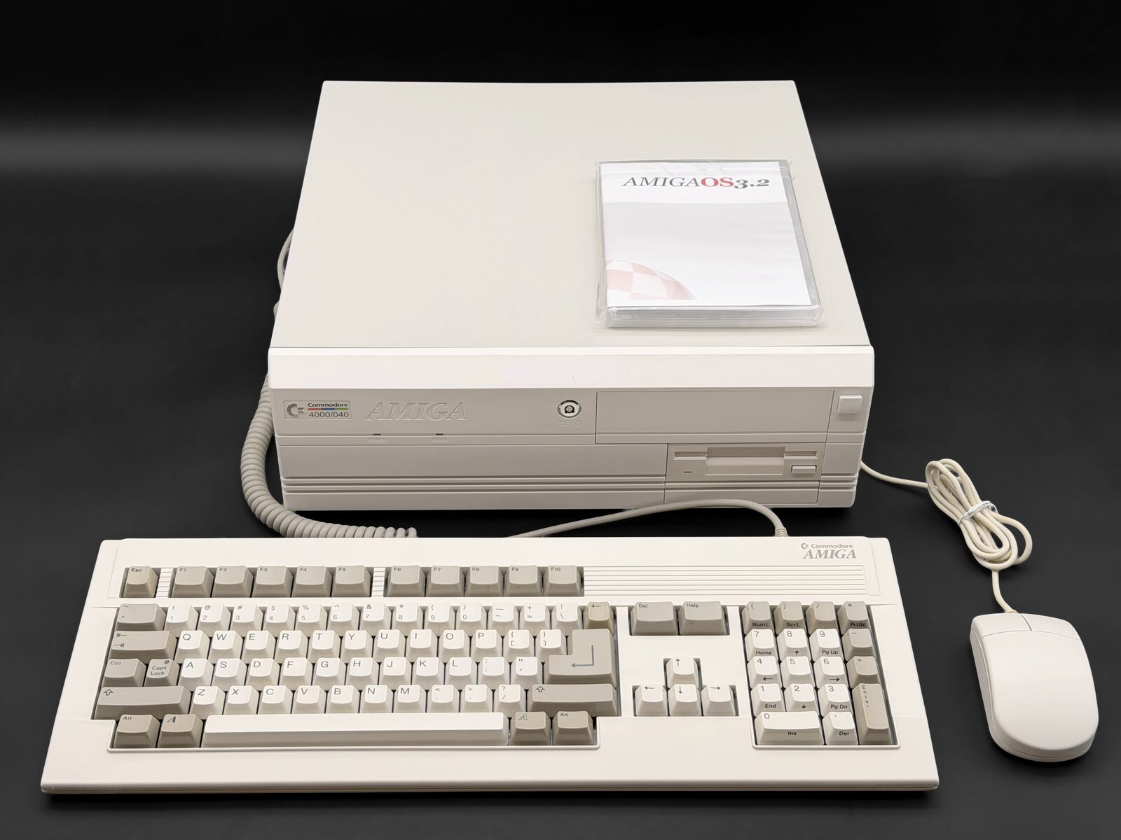 Restored Amiga 4000 desktop with keyboard, mouse and AmigaOS 3.2 on a black backdrop