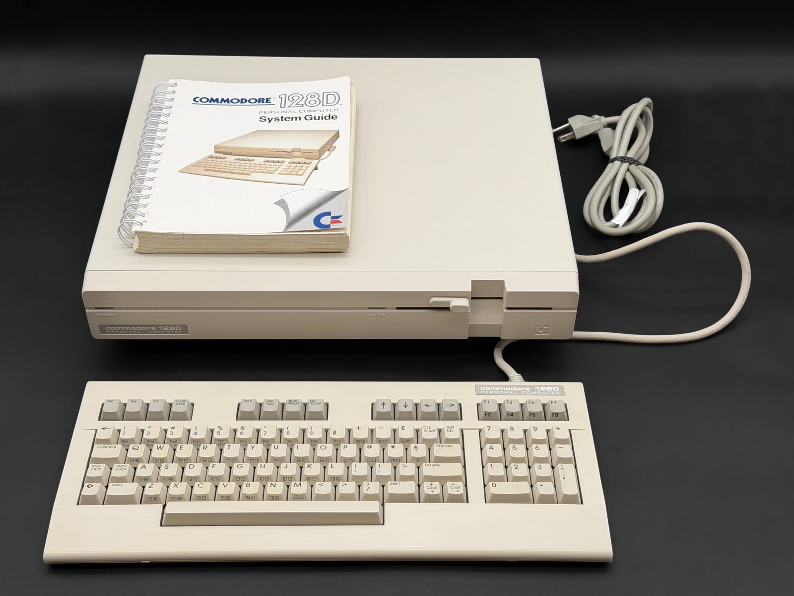 Commodore 128D with keyboard and system guide