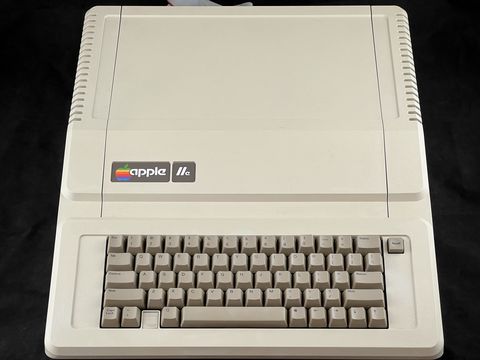 A beige original Apple IIe seen from above and slightly in front, showing its keyboard with no numeric keypad
